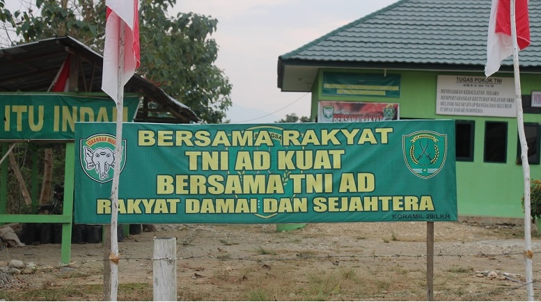 A banner in front of a military outpost in Langkahan village, North Aceh. The banner reads ‘Together with the people the TNI will be stronger’. Emirza Adi Syailendra